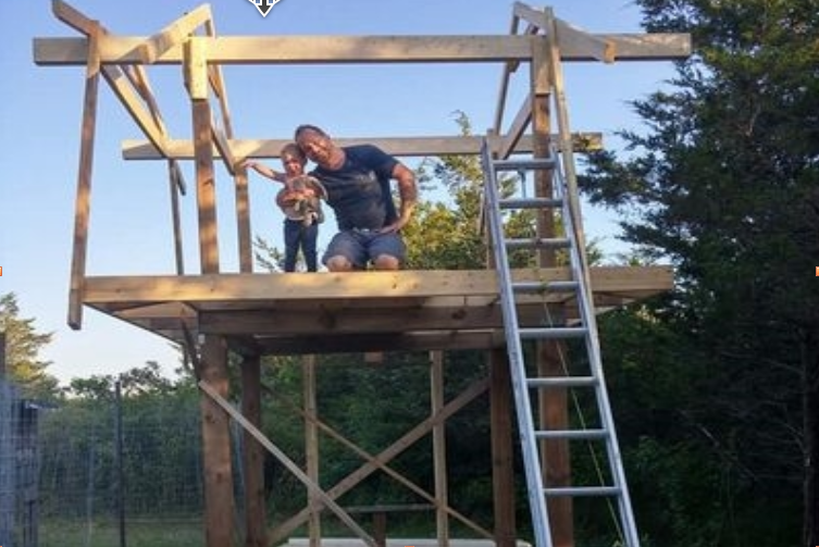 Jake and Zoe working on the post and beam frame of the straw bale coop
