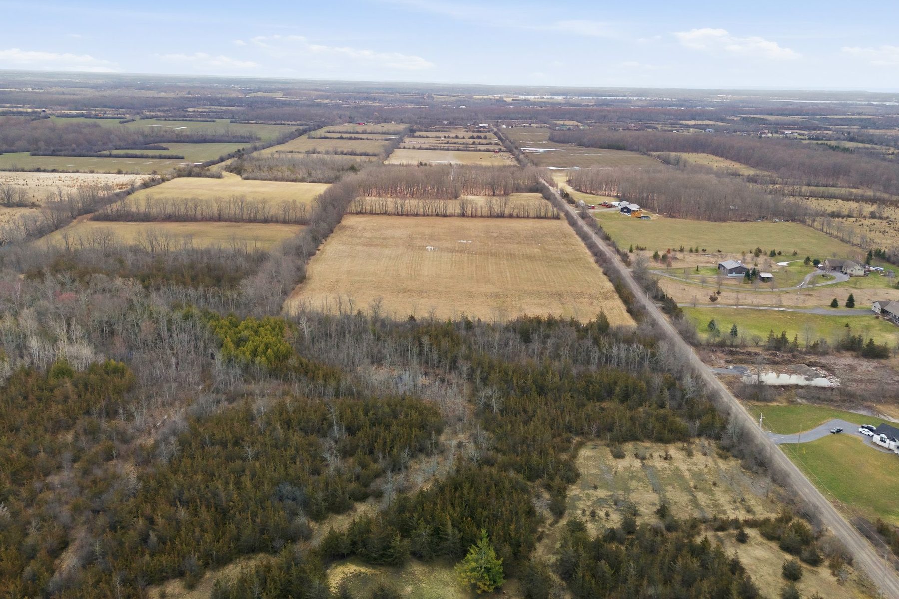 Aerial view of rural land with road frontage in Prince Edward County